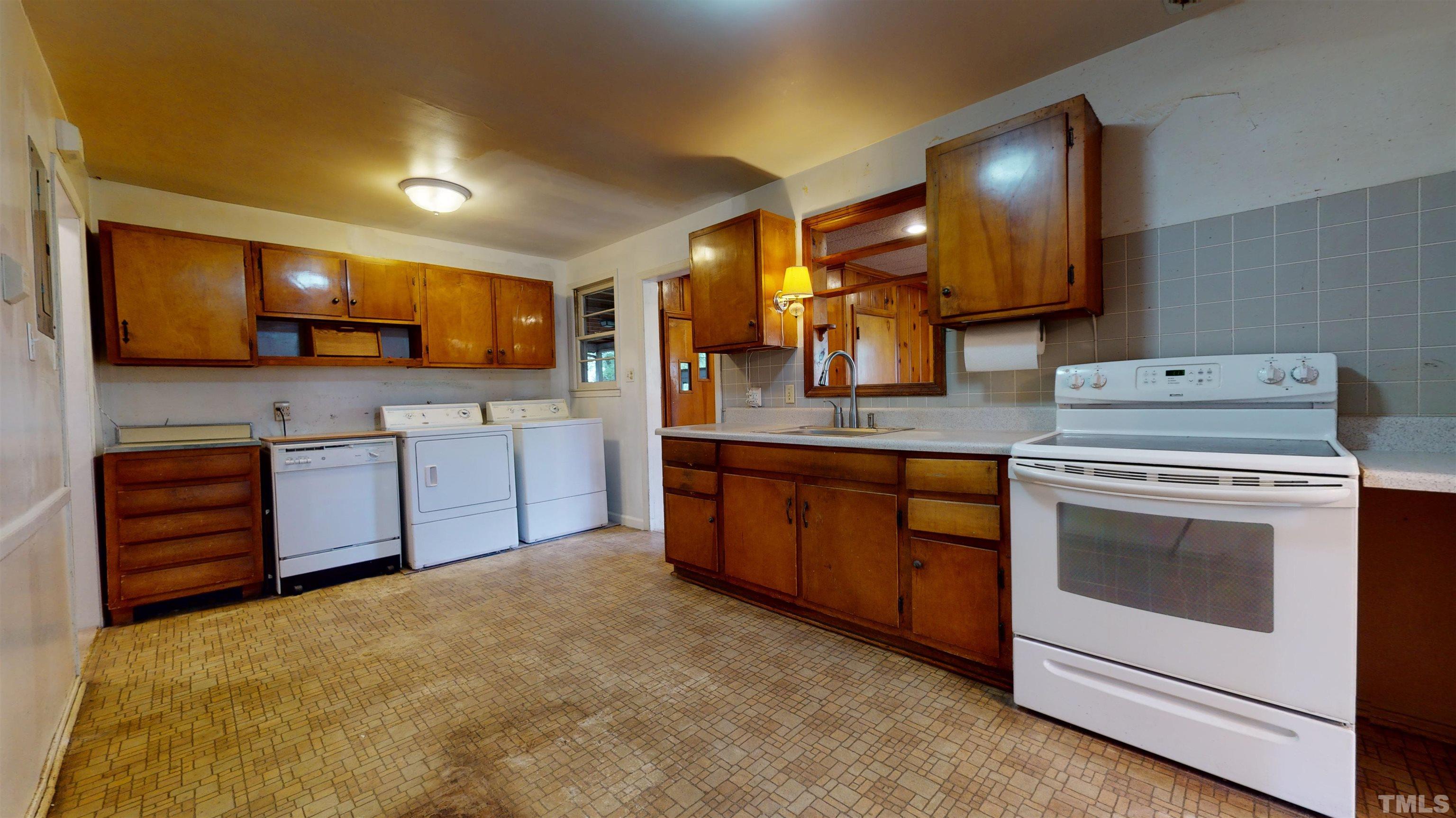 317 Quail Drive Raleigh, NC 27604 - Photo 29 of 29 a kitchen with stainless steel appliances granite countertop a stove and a sink