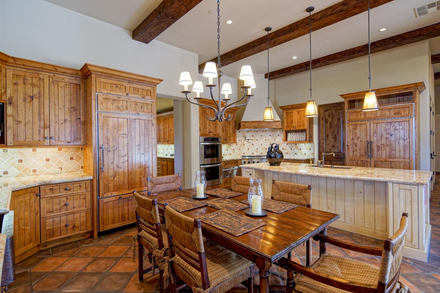 35 Rancho San Carlos Road Carmel, CA 93923 - Photo 16 of 47 a view of a dining room with furniture and chandelier