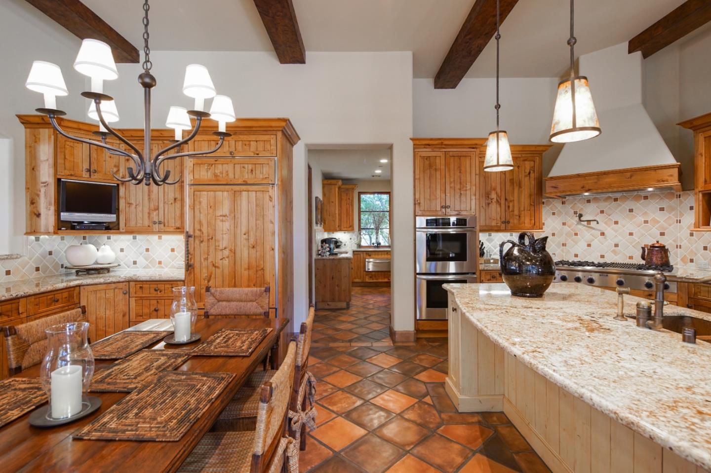 35 Rancho San Carlos Road Carmel, CA 93923 - Photo 17 of 47 a kitchen with stainless steel appliances granite countertop sink stove and refrigerator