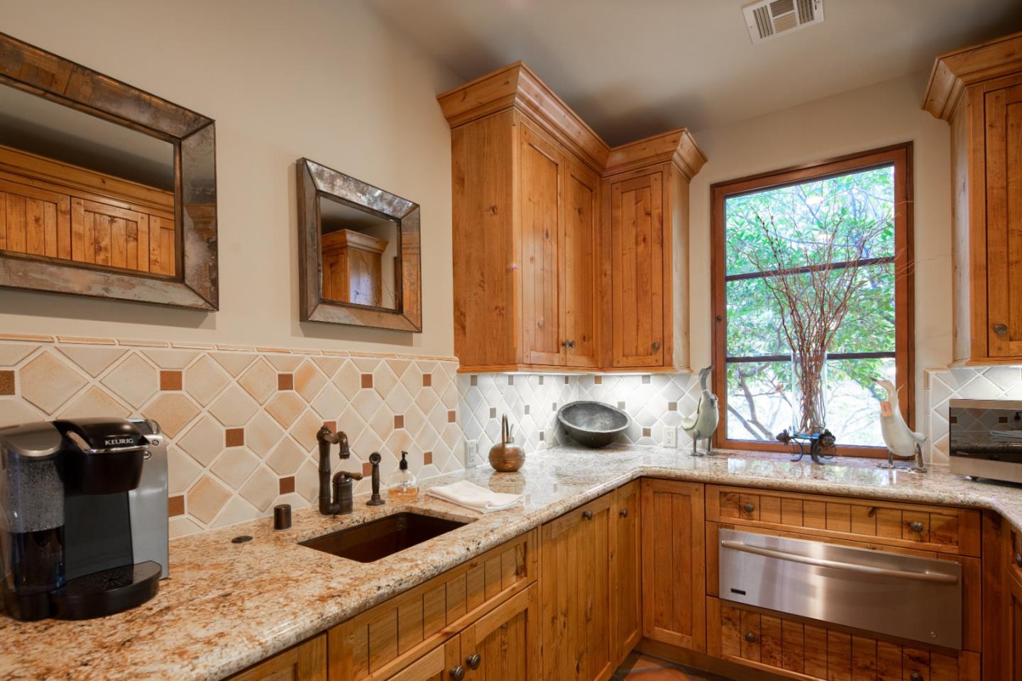 35 Rancho San Carlos Road Carmel, CA 93923 - Photo 19 of 47 a kitchen that has a sink and a stove in it