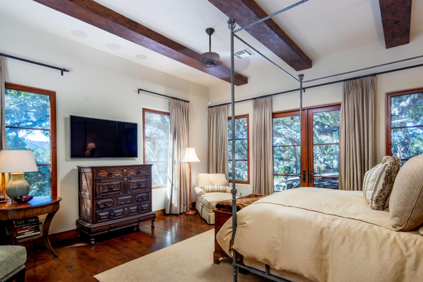 35 Rancho San Carlos Road Carmel, CA 93923 - Photo 23 of 47 a bedroom with a bed and a flat screen tv