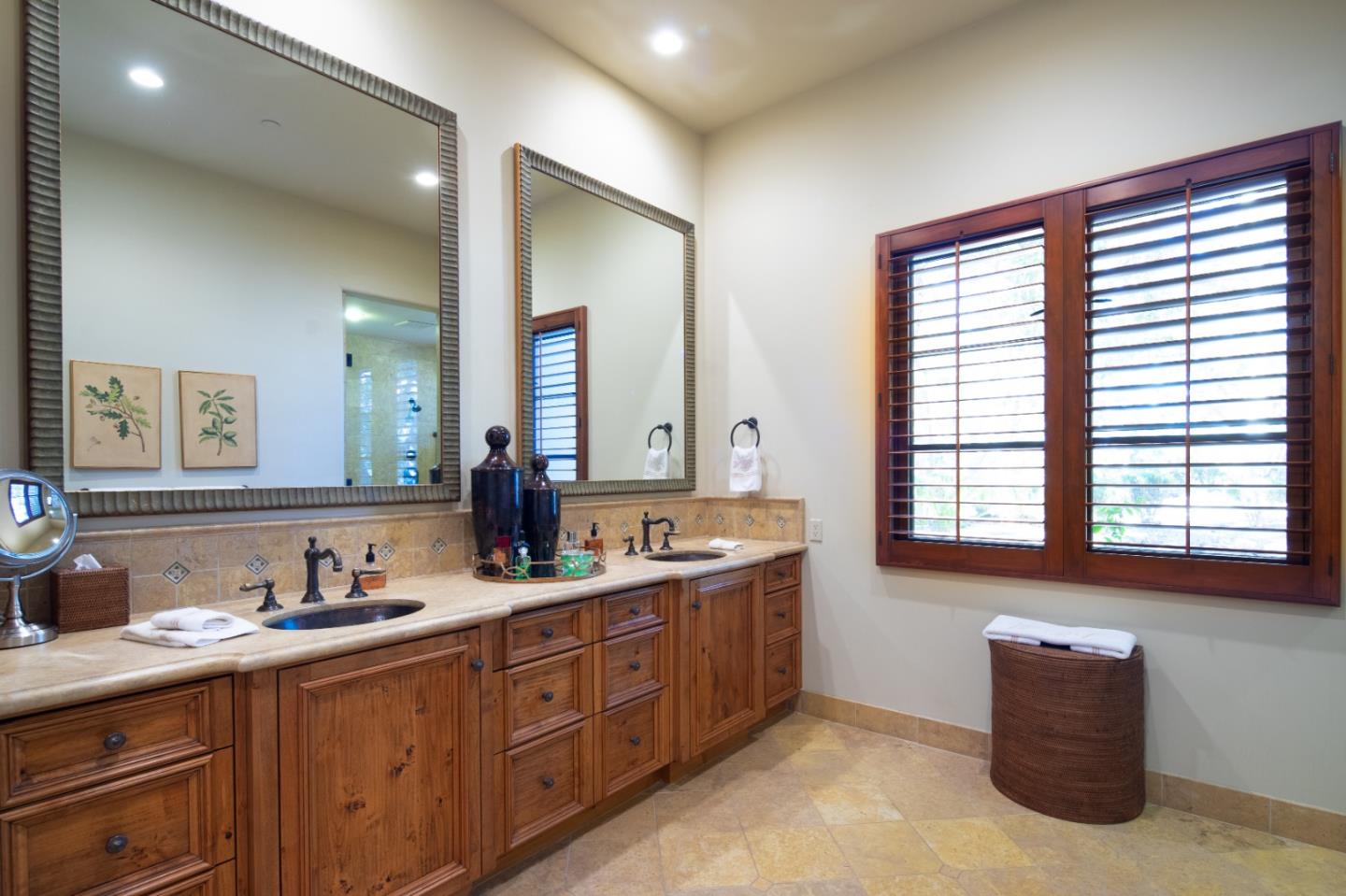 35 Rancho San Carlos Road Carmel, CA 93923 - Photo 24 of 47 a spacious bathroom with a granite countertop sink and a large mirror