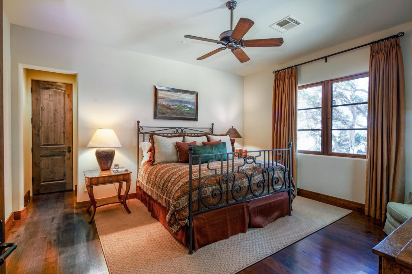 35 Rancho San Carlos Road Carmel, CA 93923 - Photo 31 of 47 a bedroom with a bed and wooden floor