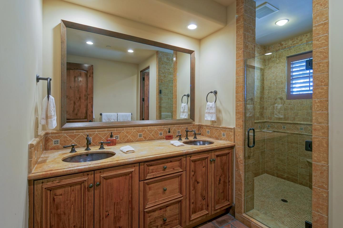35 Rancho San Carlos Road Carmel, CA 93923 - Photo 32 of 47 a bathroom with a shower sink double and mirror