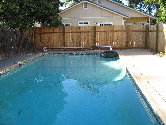 Pool surrounded by all new fencing