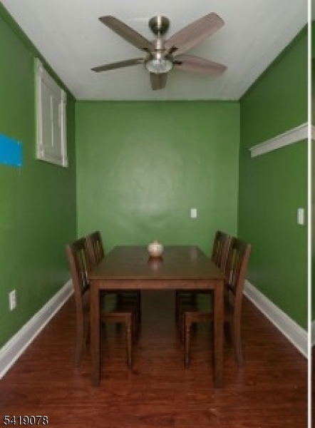 73 4th Street, Unit B1 Passaic, NJ 07055 - Photo 12 of 12 a view of a dining room with furniture and wooden floor