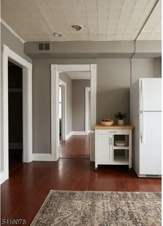 a view of kitchen with furniture and a window
