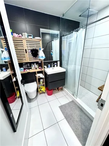 a bathroom with a bathtub and shower