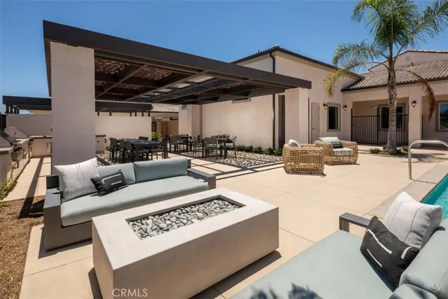 a living room with furniture and a patio