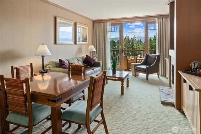 a view of a dining room with furniture window and outside view