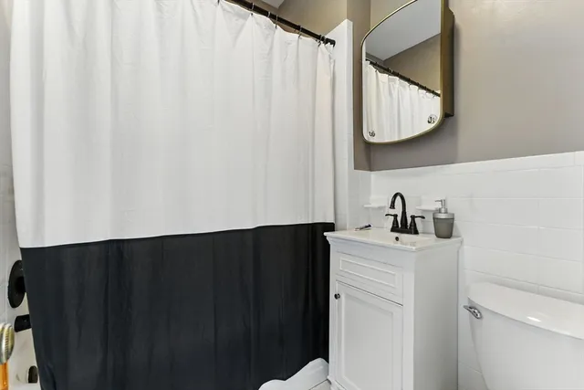 a close up of a sink and a mirror