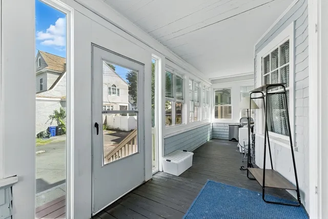 a work room with furniture and a rug