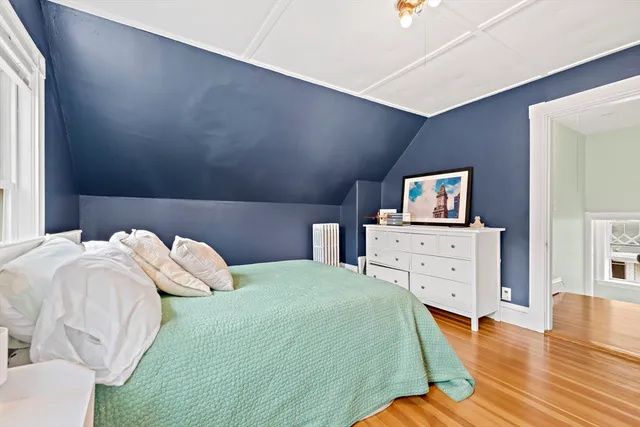 a bedroom with a bed and a dresser