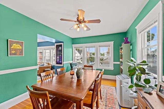 a kitchen with a table chairs stove and cabinets