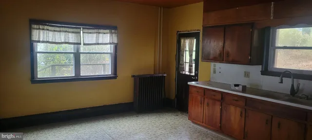 a kitchen with a sink and a window