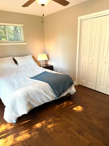 a bedroom with bed and window