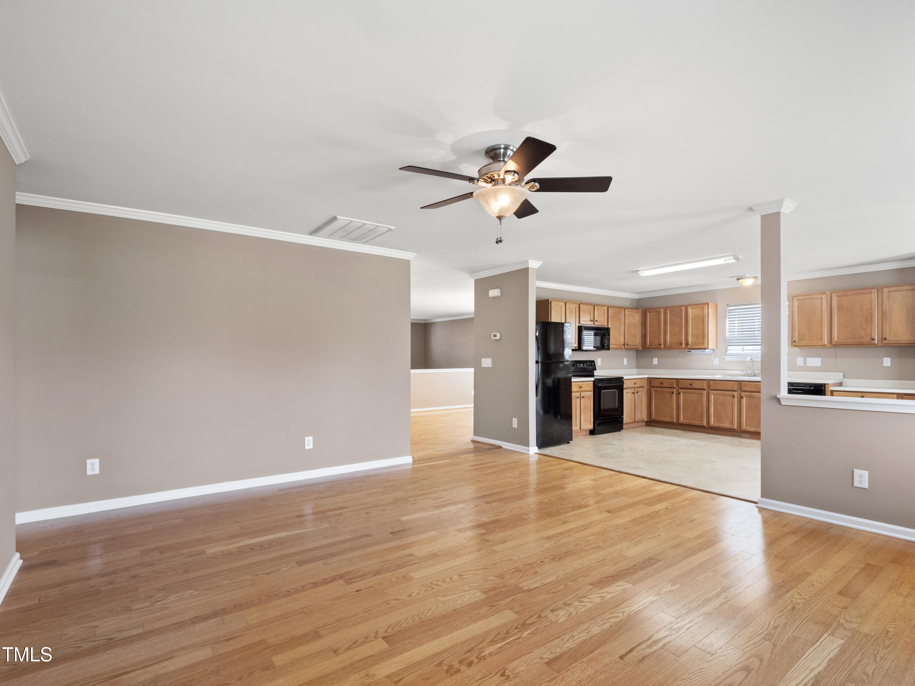 115 Geranium Street Durham, NC 27704 - Photo 14 of 47 a view of a kitchen with a sink and a chandelier fan