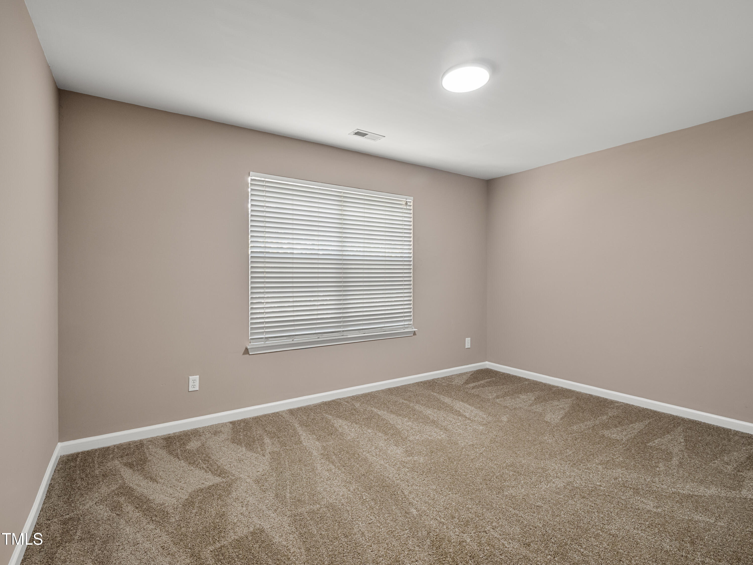 115 Geranium Street Durham, NC 27704 - Photo 27 of 47 a view of an empty room with a window