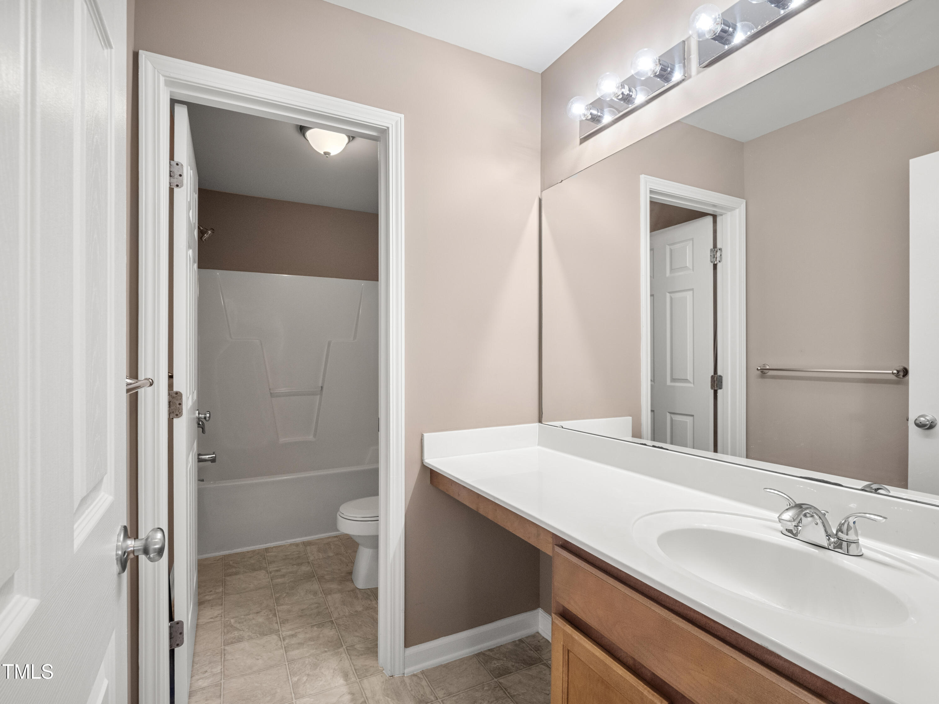 115 Geranium Street Durham, NC 27704 - Photo 29 of 47 a bathroom with a sink and a mirror