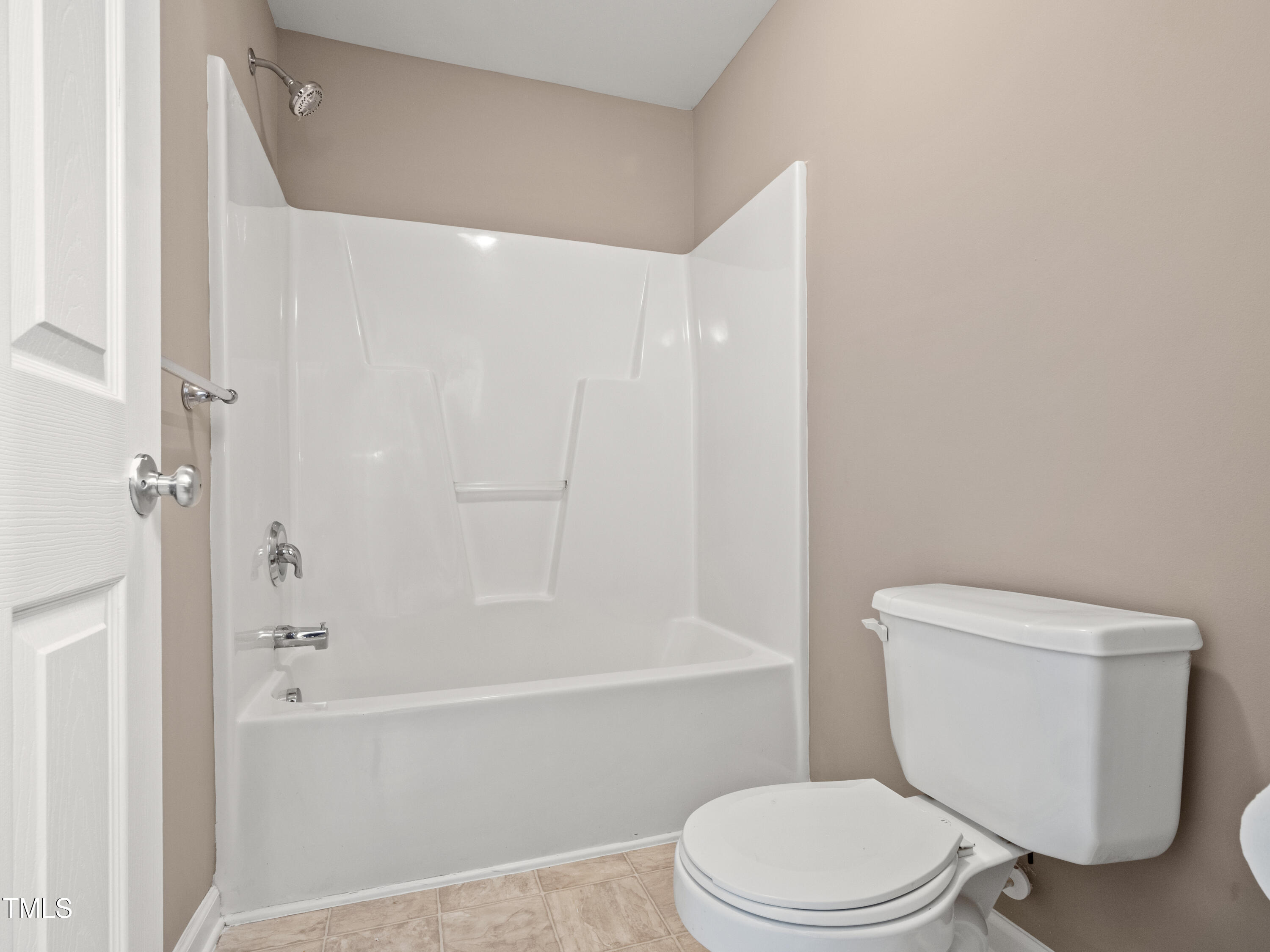 115 Geranium Street Durham, NC 27704 - Photo 30 of 47 a white toilet and tub next to a white cabinet