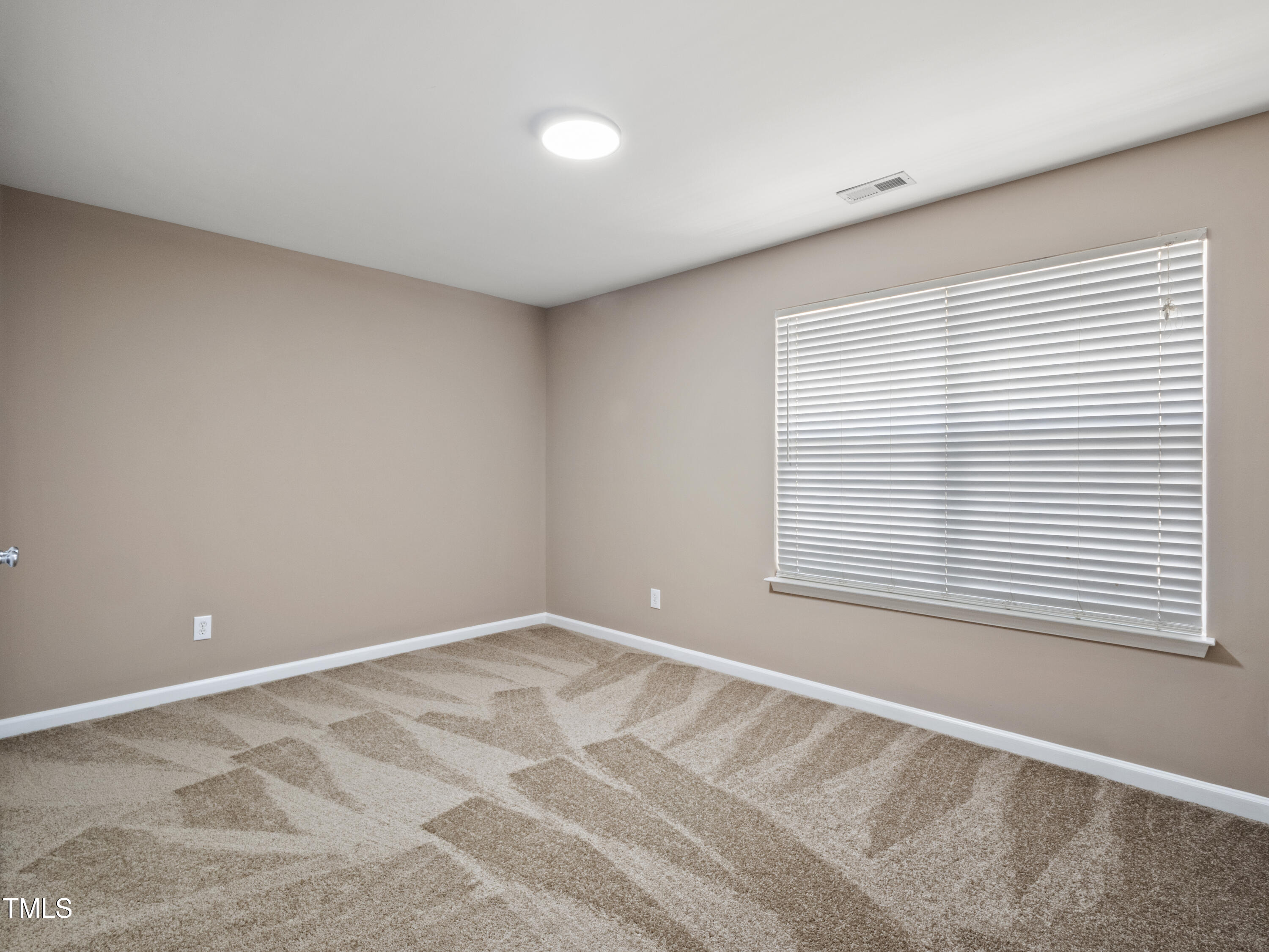 115 Geranium Street Durham, NC 27704 - Photo 32 of 47 a view of an empty room with a window