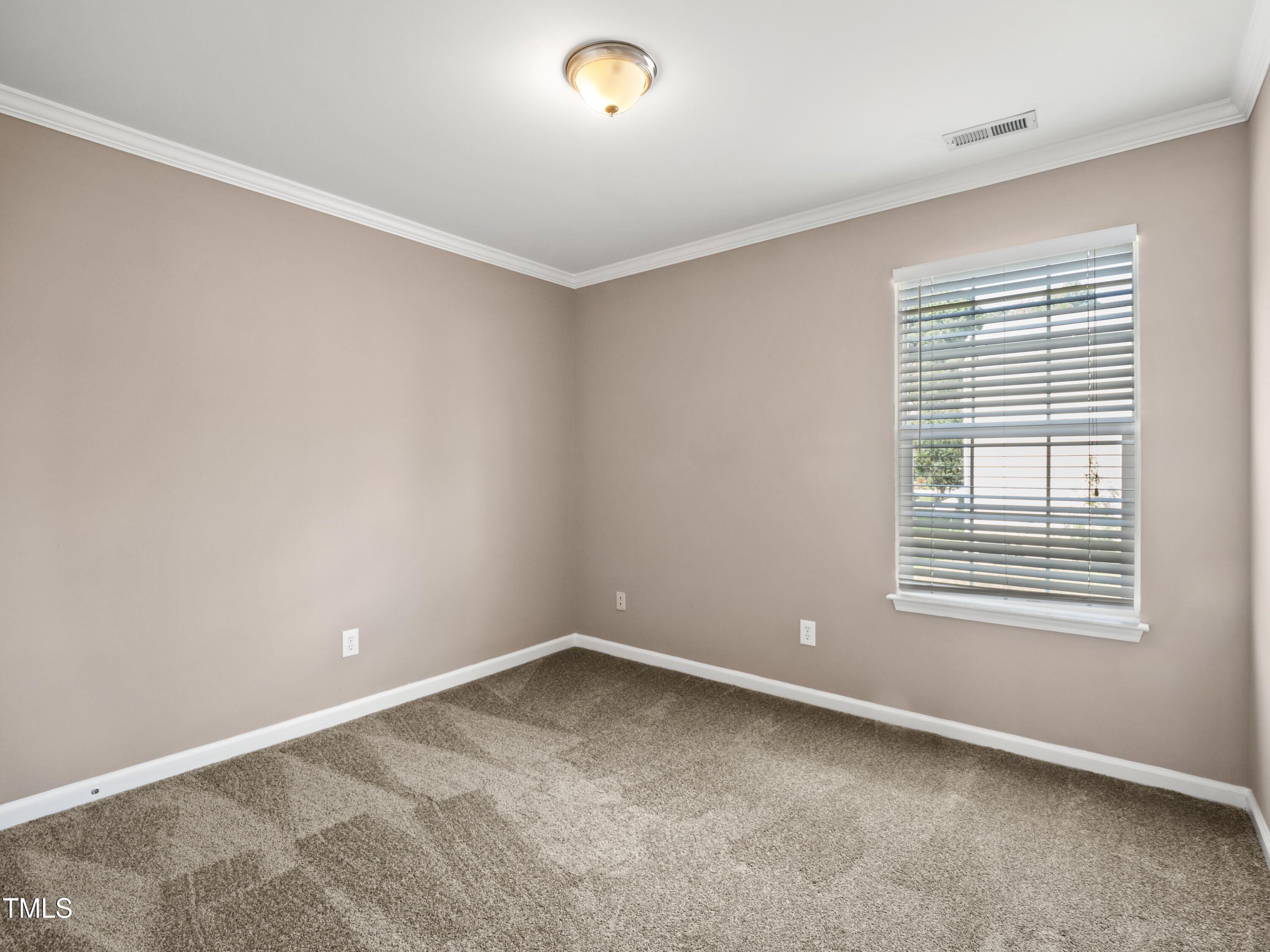 115 Geranium Street Durham, NC 27704 - Photo 35 of 47 a view of an empty room with a window