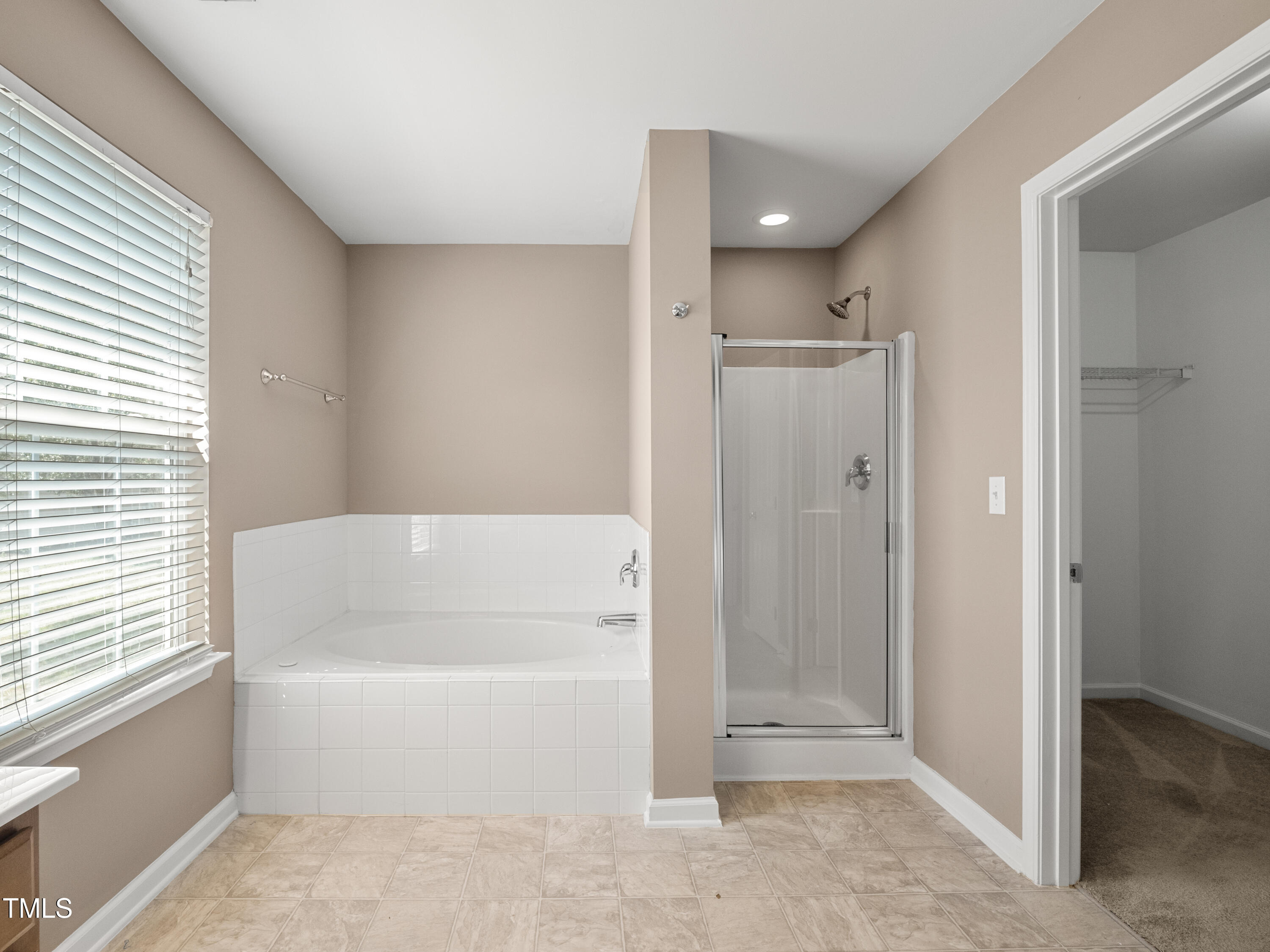 115 Geranium Street Durham, NC 27704 - Photo 45 of 47 a bathroom with a bathtub and a shower