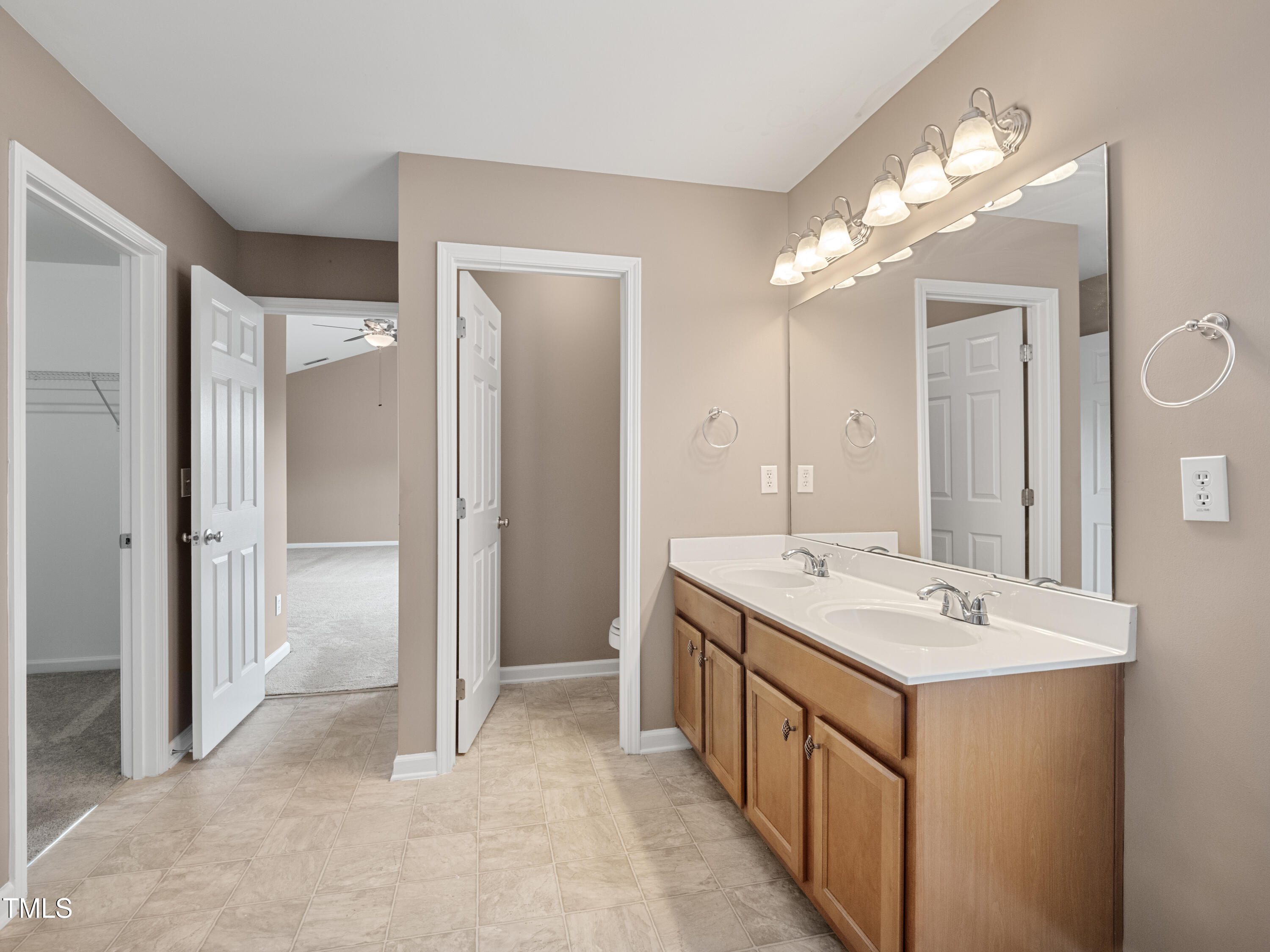 115 Geranium Street Durham, NC 27704 - Photo 46 of 47 a bathroom with a sink a vanity and a mirror