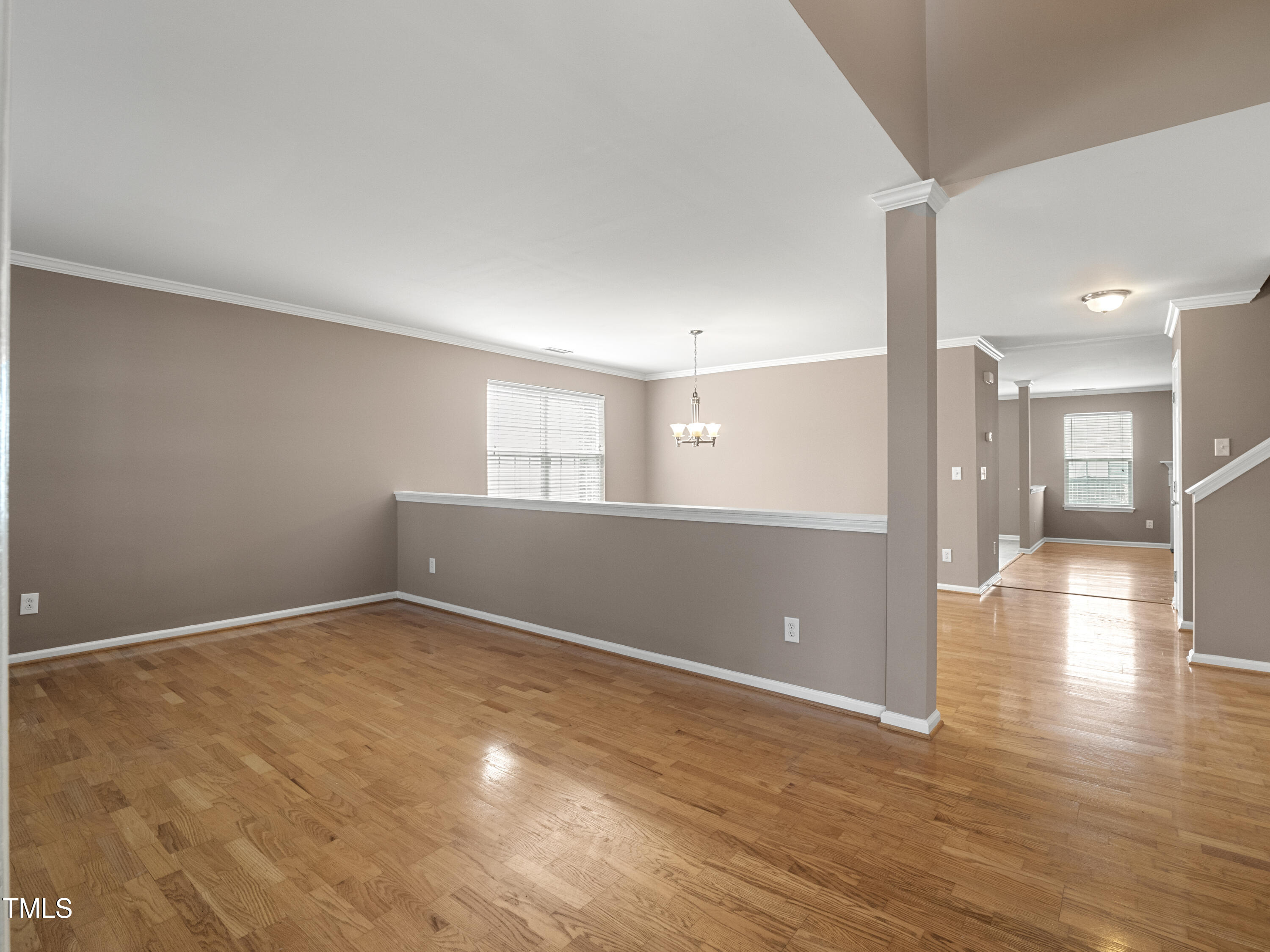 115 Geranium Street Durham, NC 27704 - Photo 7 of 47 a view of an empty room with wooden floor and a window