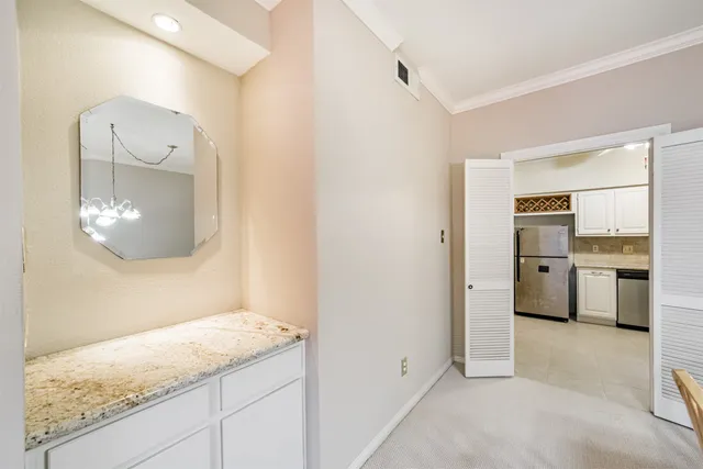 a view of a kitchen cabinets and wooden floor