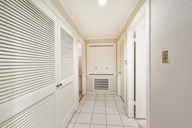 a view of a kitchen from the hallway