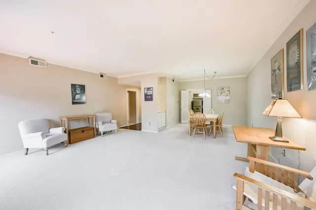 a living room with furniture and a lamp