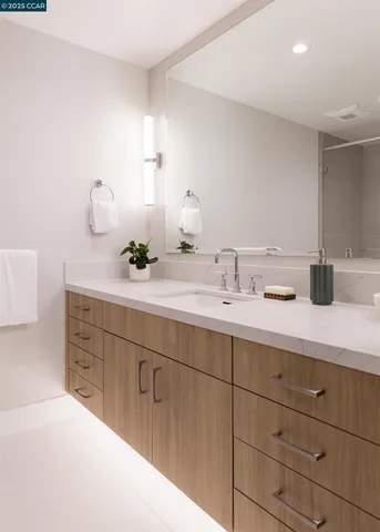 a bathroom with a double vanity sink and a mirror