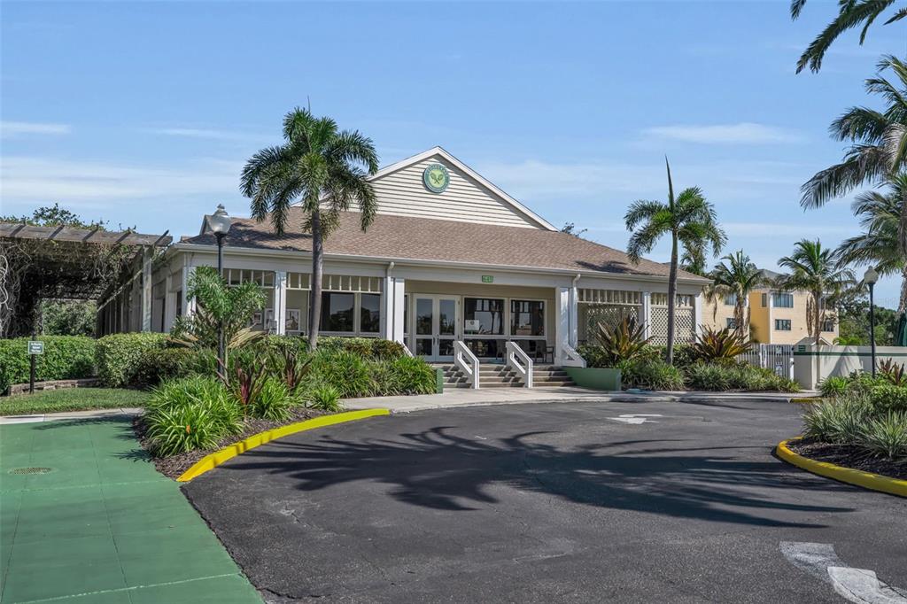 848 Evergreen Way Longboat Key, FL 34228 - Photo 54 of 66 a front view of a house with garden