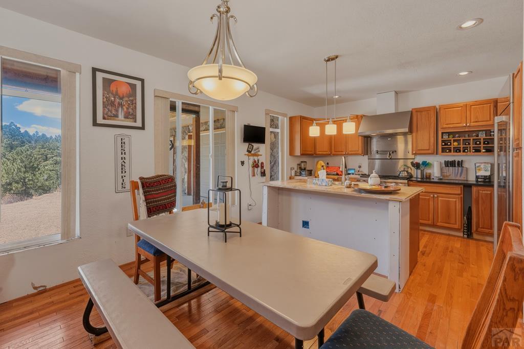 7880 Old Sopris Road Trinidad, CO 81082 - Photo 12 of 49 a kitchen with a table chairs and refrigerator