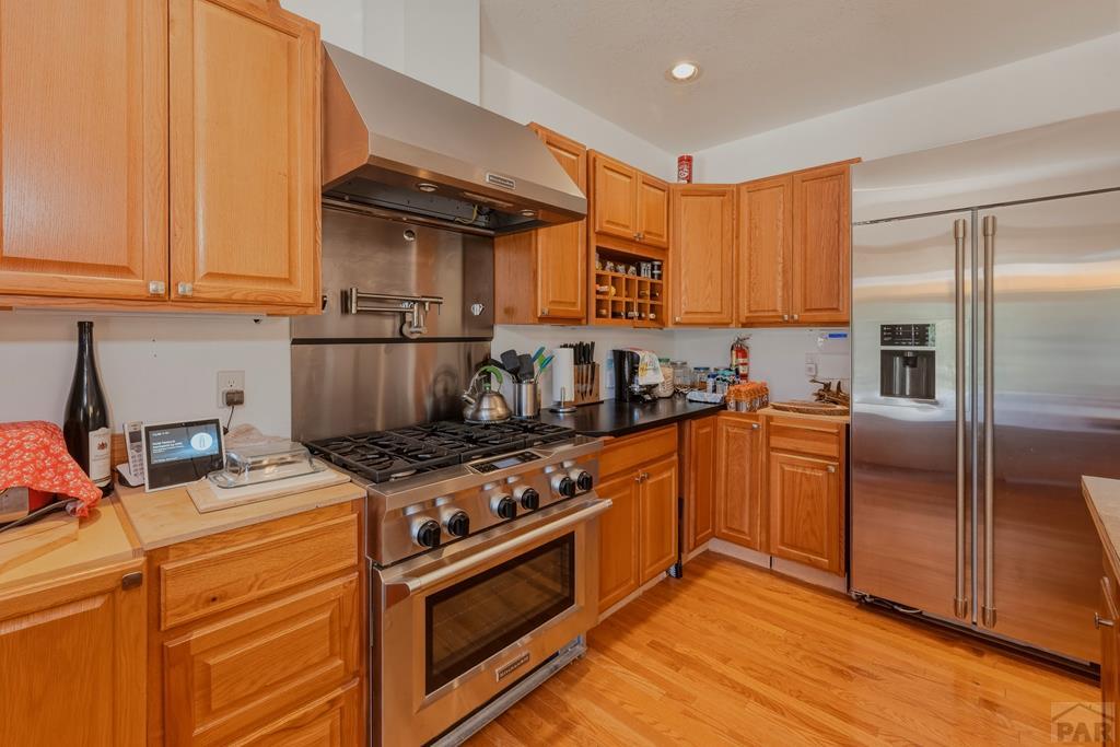 7880 Old Sopris Road Trinidad, CO 81082 - Photo 15 of 49 a kitchen with stainless steel appliances granite countertop a stove a sink and a refrigerator