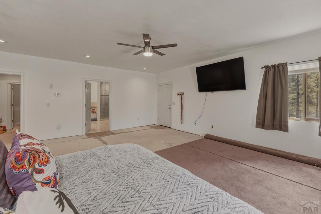 7880 Old Sopris Road Trinidad, CO 81082 - Photo 16 of 49 a bedroom with a bed and a flat screen tv