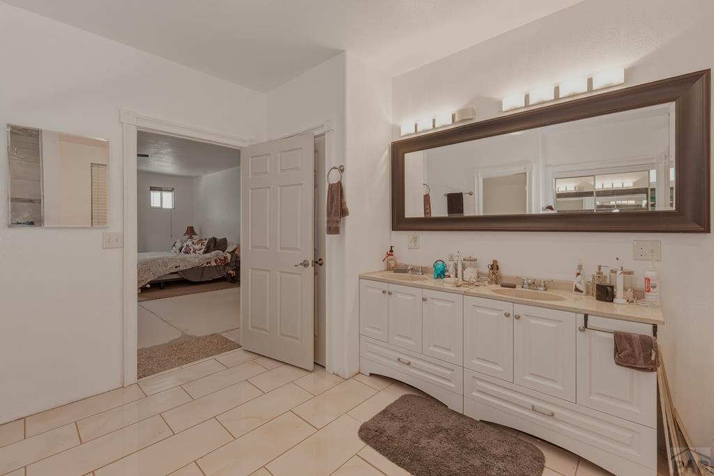 7880 Old Sopris Road Trinidad, CO 81082 - Photo 20 of 49 a bathroom with a sink a toilet and a mirror