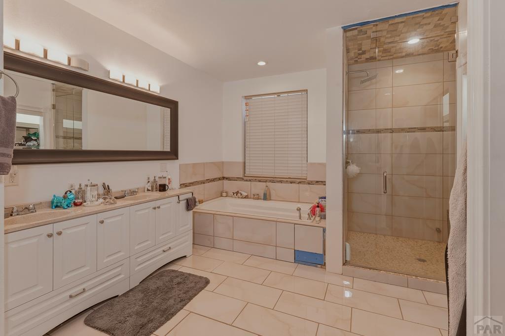 7880 Old Sopris Road Trinidad, CO 81082 - Photo 21 of 49 a bathroom with a bathtub sink mirror and shower