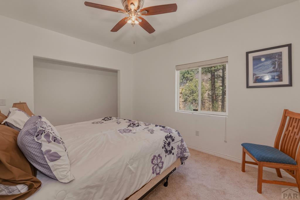 7880 Old Sopris Road Trinidad, CO 81082 - Photo 22 of 49 a bedroom with a bed and a chair