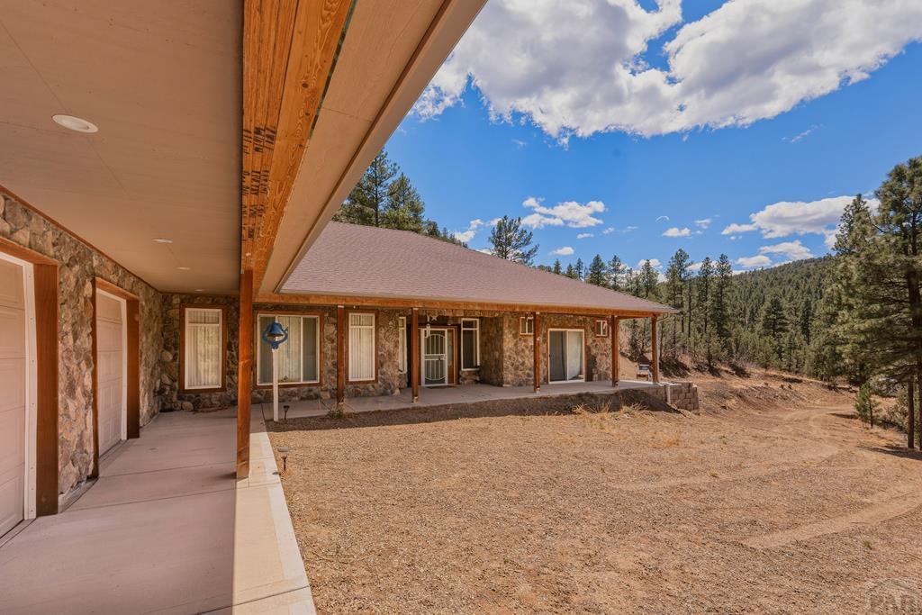 7880 Old Sopris Road Trinidad, CO 81082 - Photo 4 of 49 a front view of a house with a yard