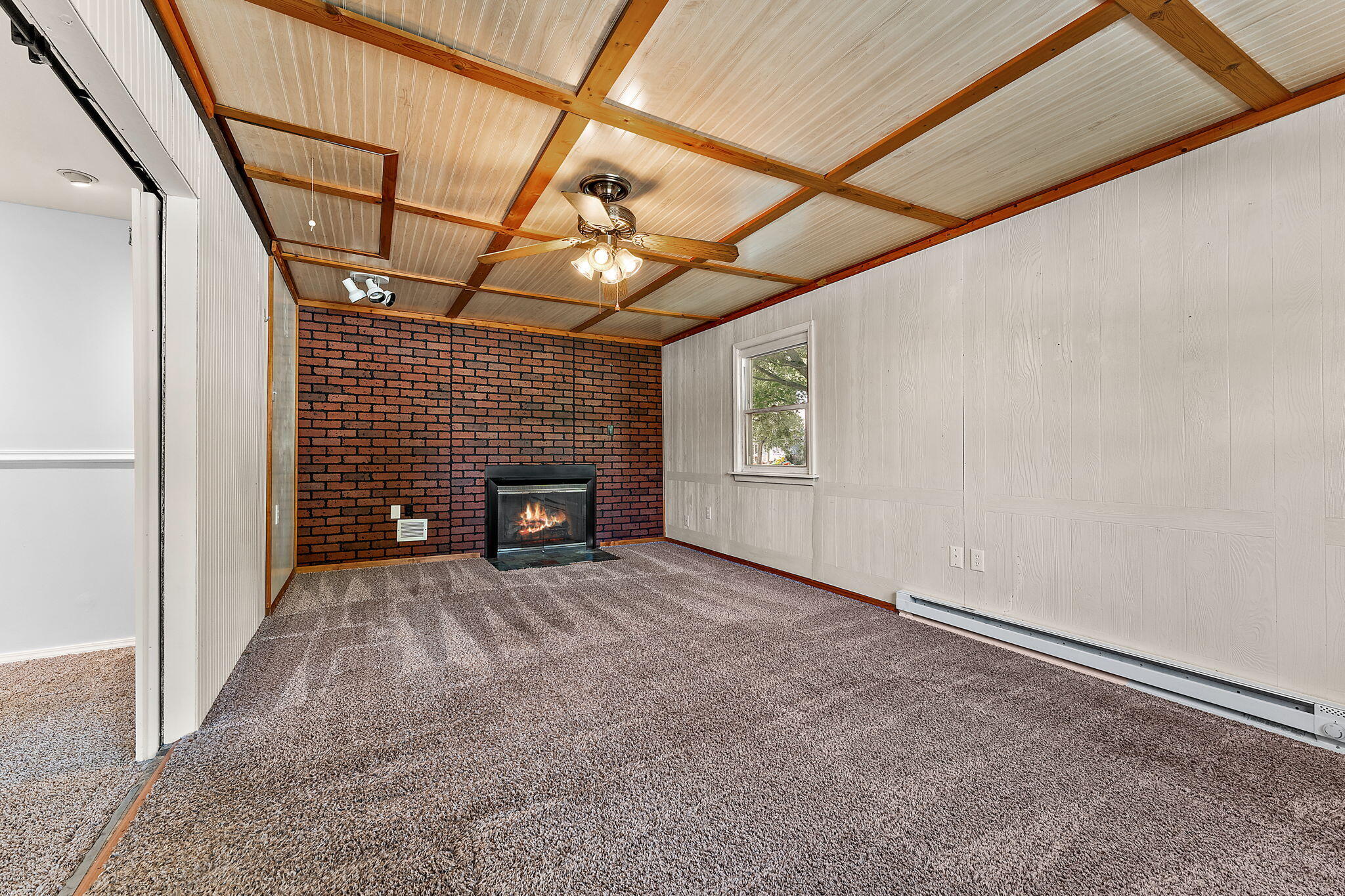 739 Eagle Creek Road Valparaiso, IN 46385 - Photo 7 of 23 a view of an empty room with a fireplace