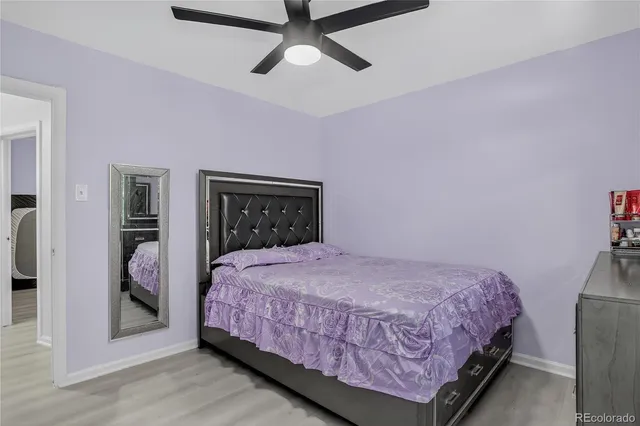 a bedroom with a bed and a dresser