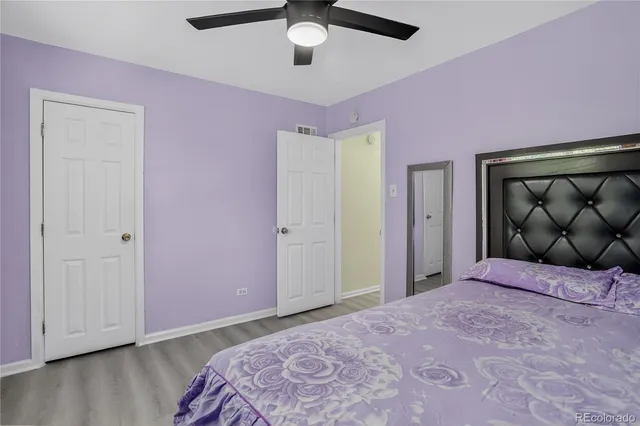 a bedroom with a bed dresser and a window