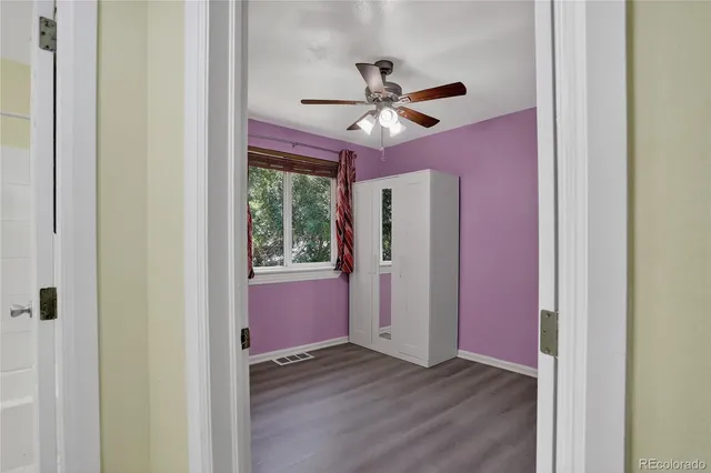 a bathroom with a sink mirror and toilet