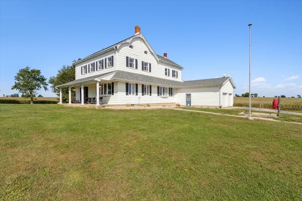 a view of a patio with table and chairs