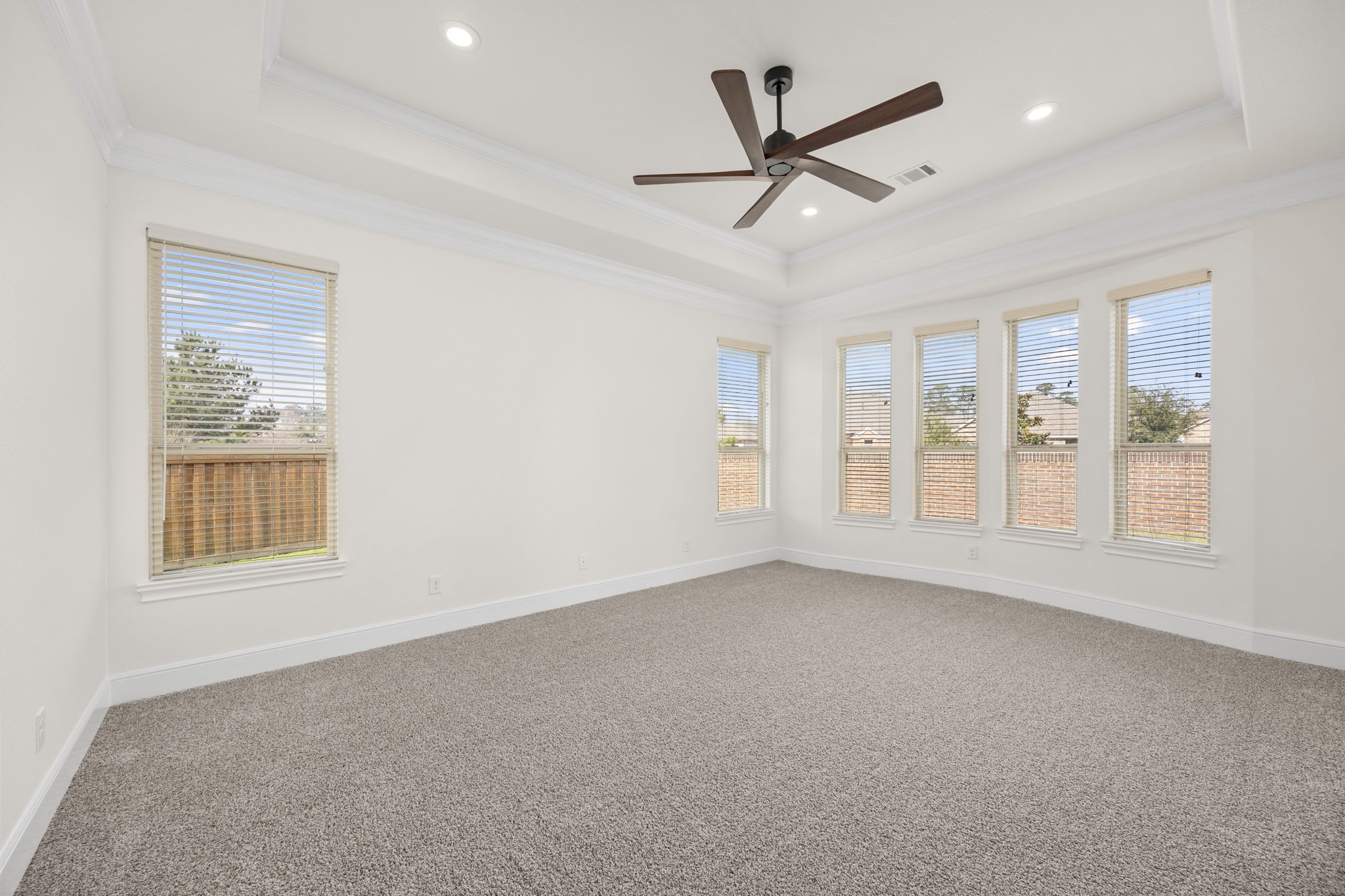 8551 Tombron Grove Road Magnolia, TX 77354 - Photo 25 of 49 The luxurious primary bedroom is a true private retreat, thoughtfully situated in its own first floor wing for maximum comfort & privacy.