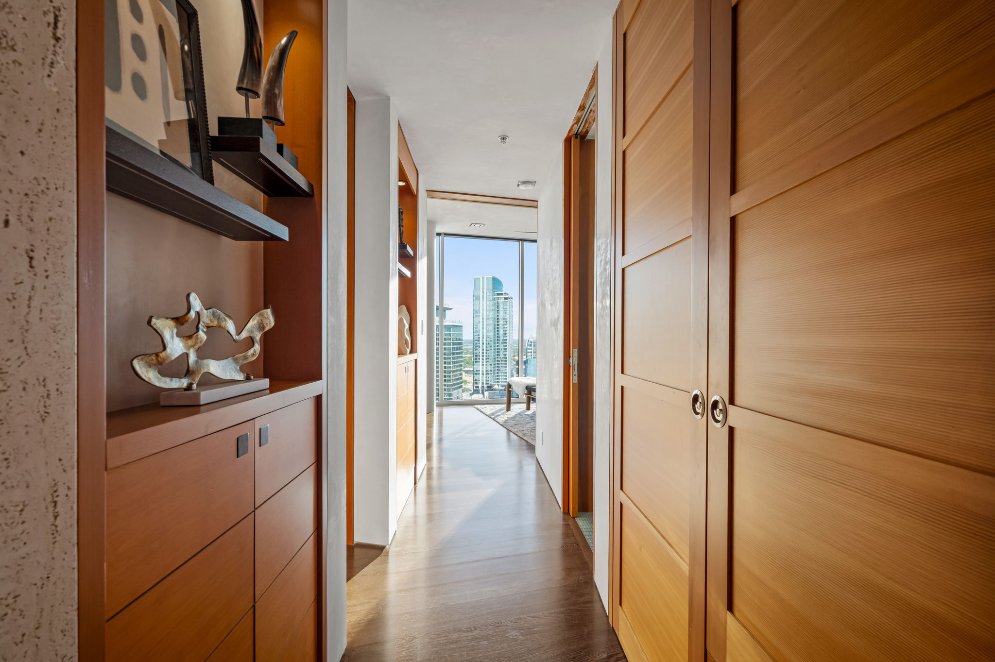 360 Nueces Street, Unit 4211 Austin, TX 78701 - Photo 21 of 40 a view of hallway with wooden floor and cabinets