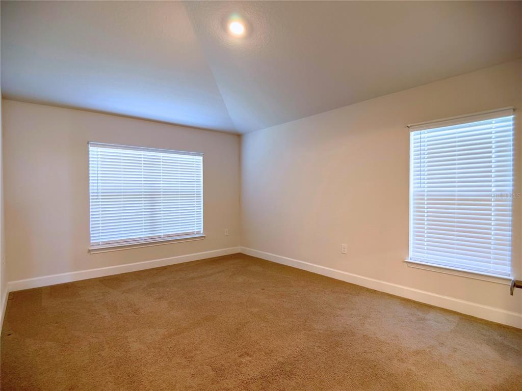 4549 Southeast 25th Loop Ocala, FL 34480 - Photo 11 of 25 an empty room with a window