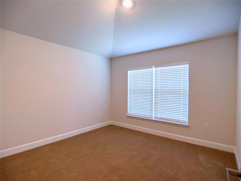 4549 Southeast 25th Loop Ocala, FL 34480 - Photo 14 of 25 an empty room with a window